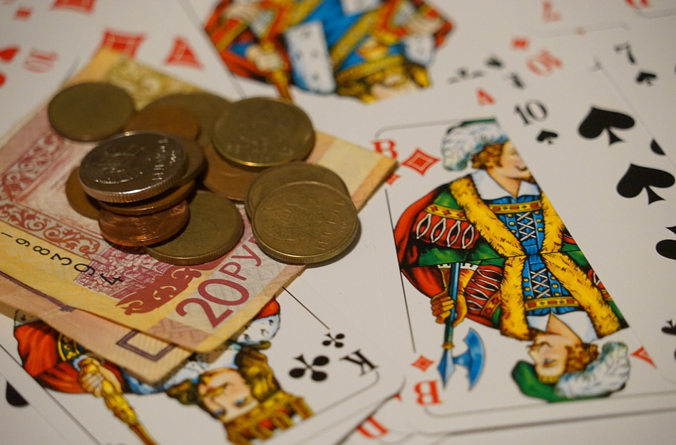 money with cards on a table